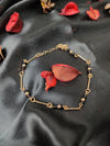 Sleek Black Beads Anklet In Gold Tone