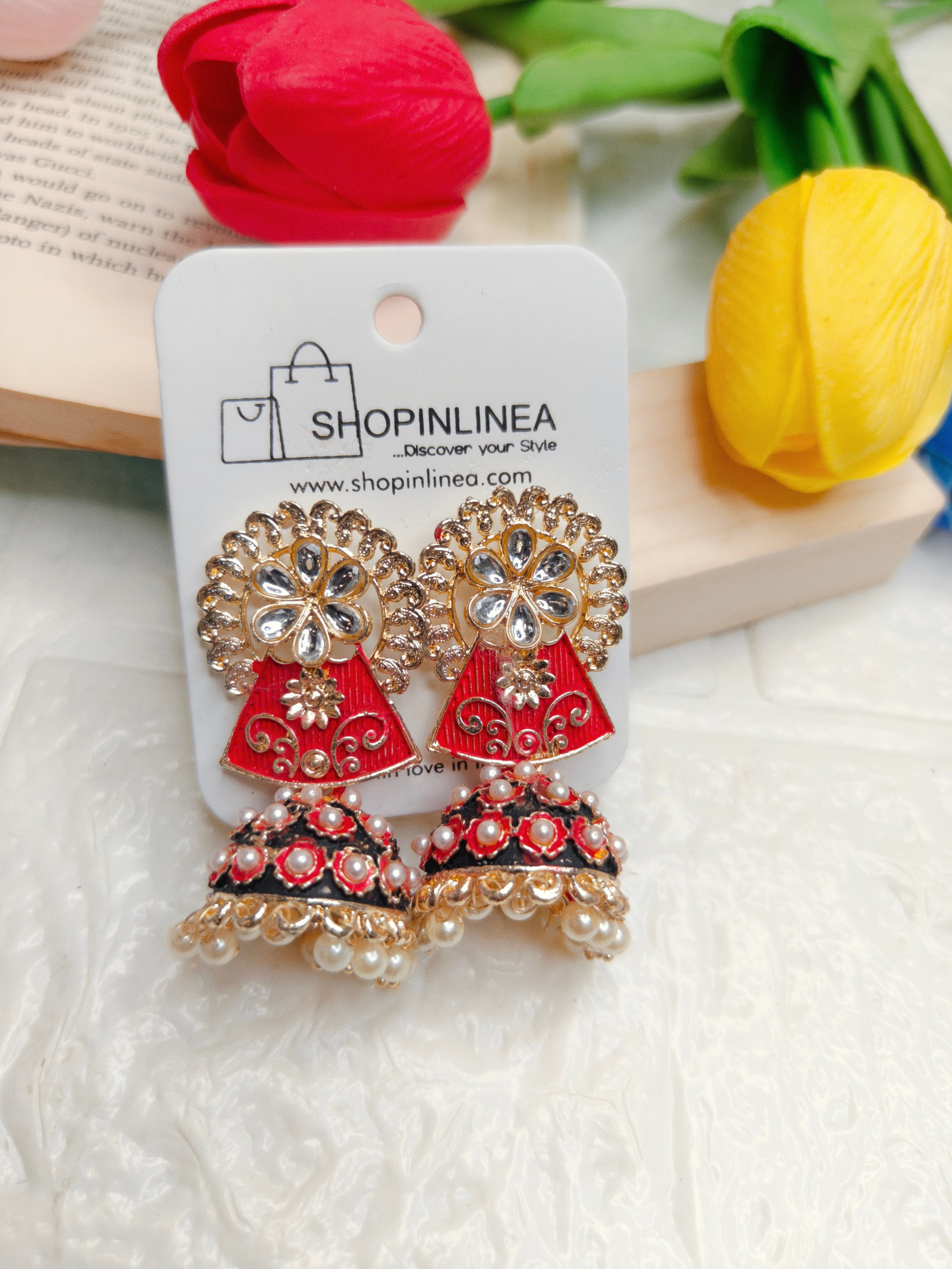 Red and black Meenakari enamel Jhumka earrings feature pearl details