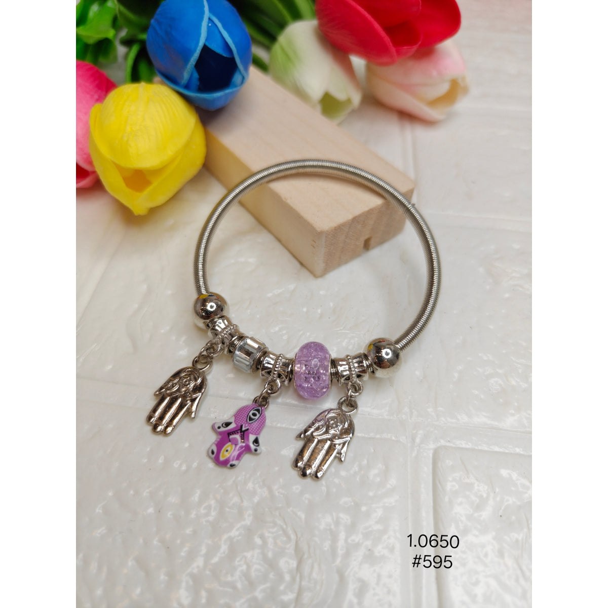 Elegent Silver and Pink eyed palm is a charm bracelet