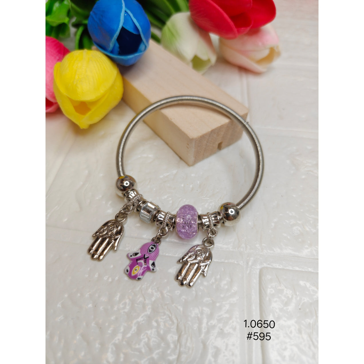 Elegent Silver and Pink eyed palm is a charm bracelet