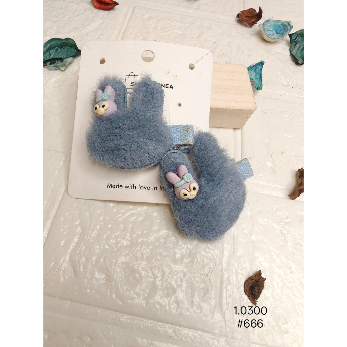 fuzzy blue bunny-shaped hair clips