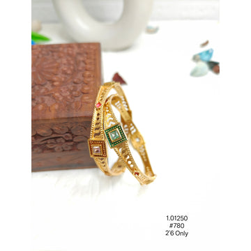 Ethnic Gold-Plated Bangles with Intricate Cutwork & Red Green Stones