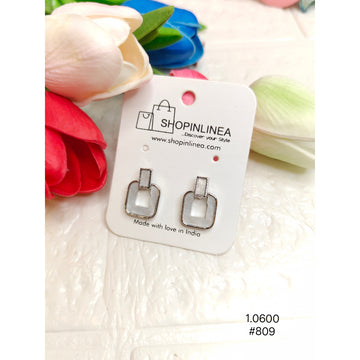 silver-colored stud earrings